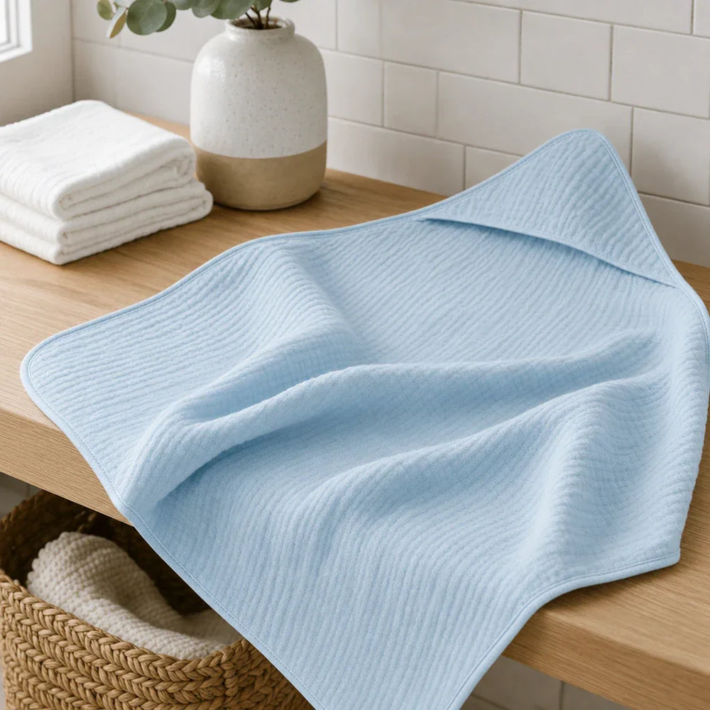 Cape de bain bébé en mousseline
